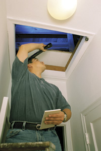 Contractor checking insulation